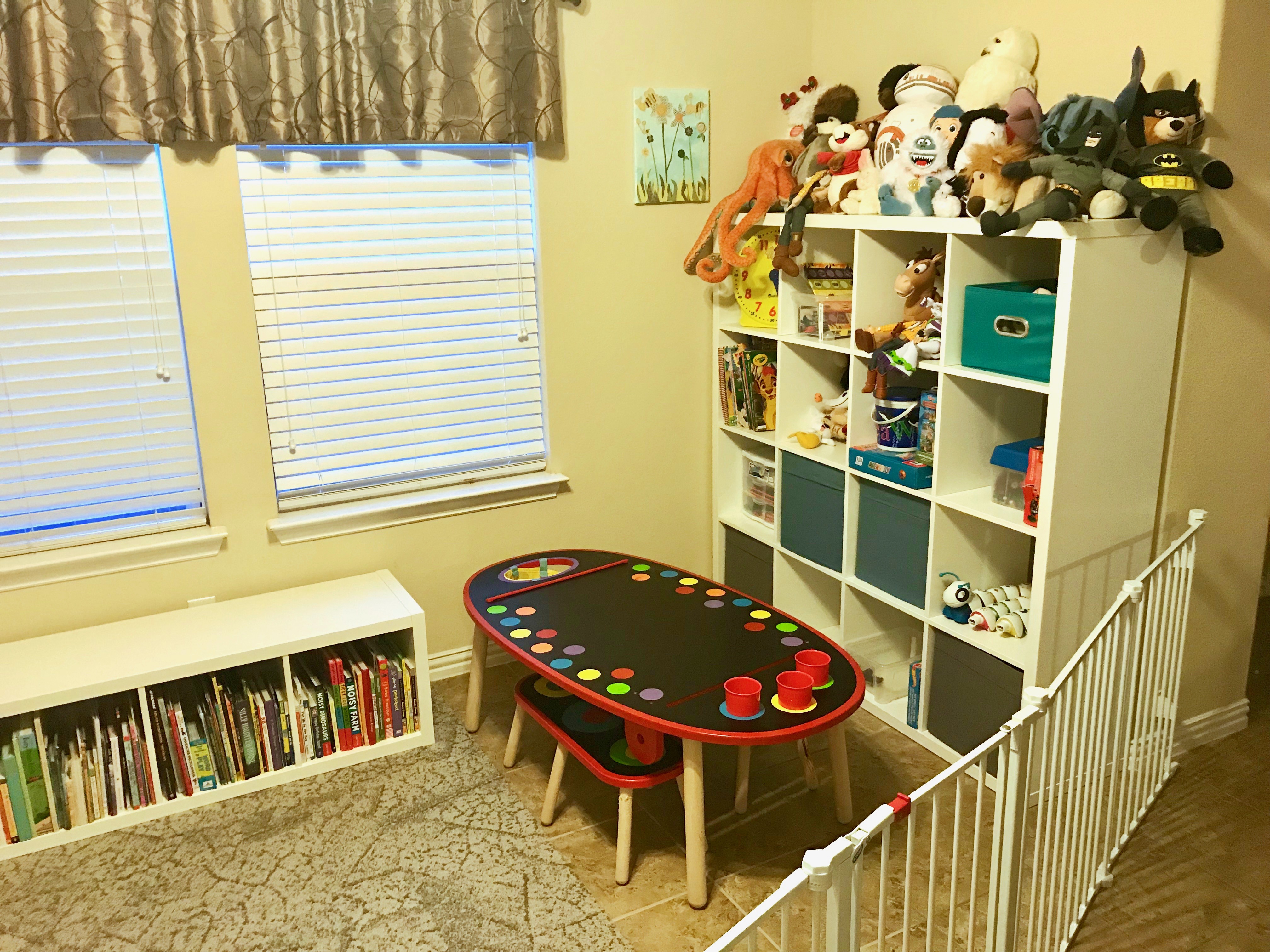 Playroom design on a budget. We used IKEA storage to create a fun kid friendly place for our son to craft, create, and play with plenty of storage for his toys.