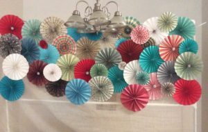 Pinwheel backdrop hanging from PVC pipe stand-alone frame. 