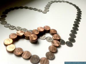 Pennies and dimes in the shape of overlapping hearts