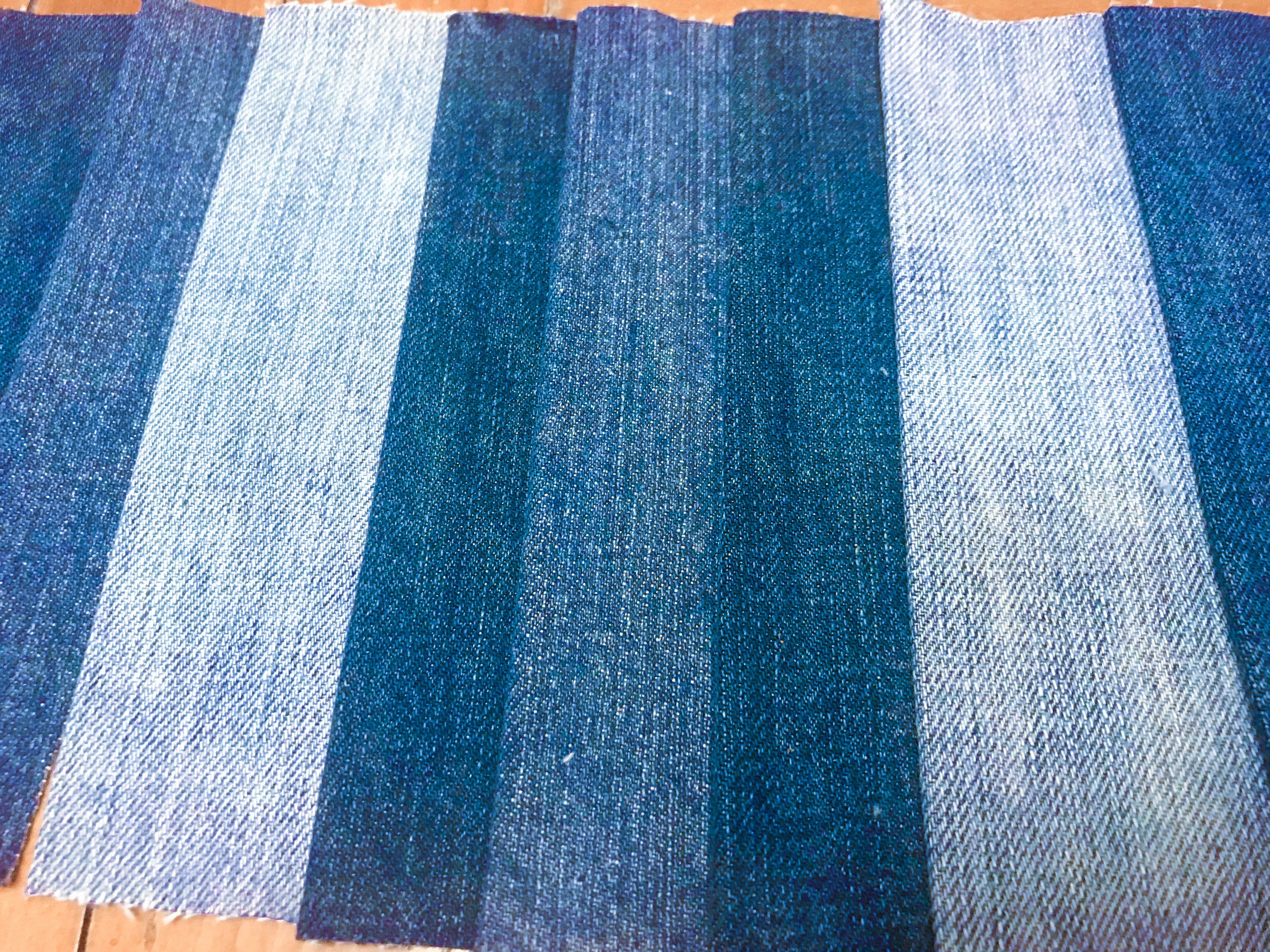 Jean strips of varying shades side by side.