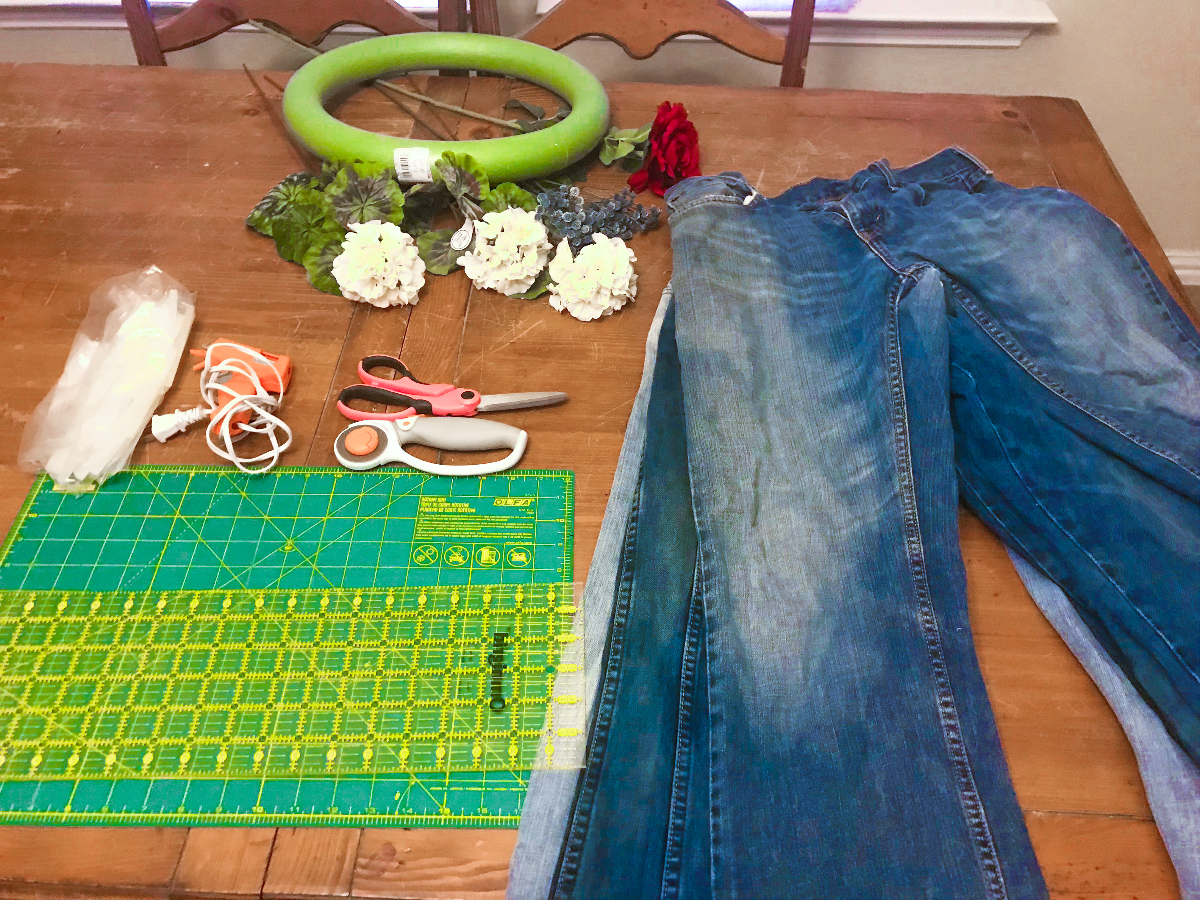 Wreath making supplies and pairs of old jeans.