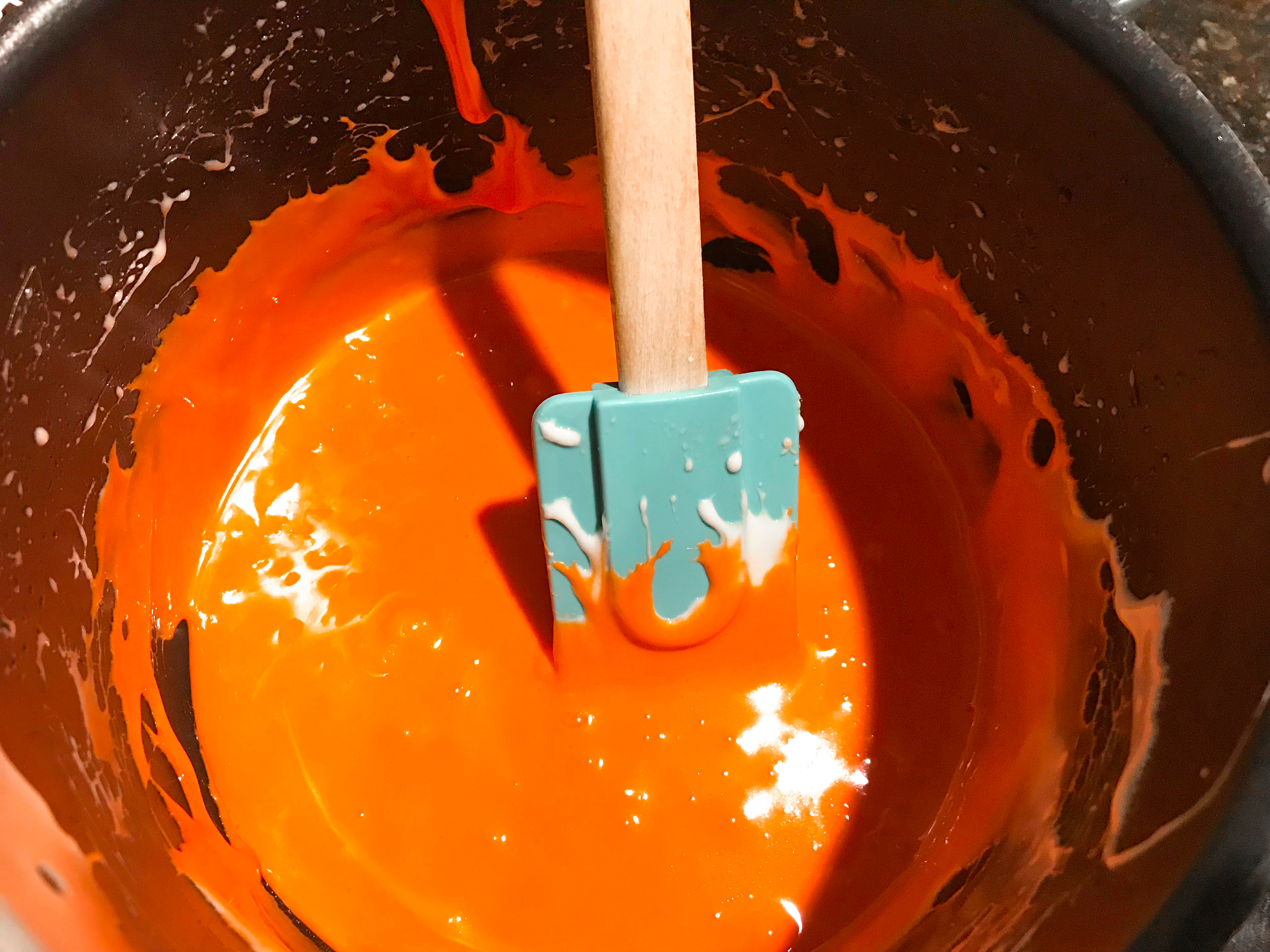 Orange melted marshmallow in a pot. 