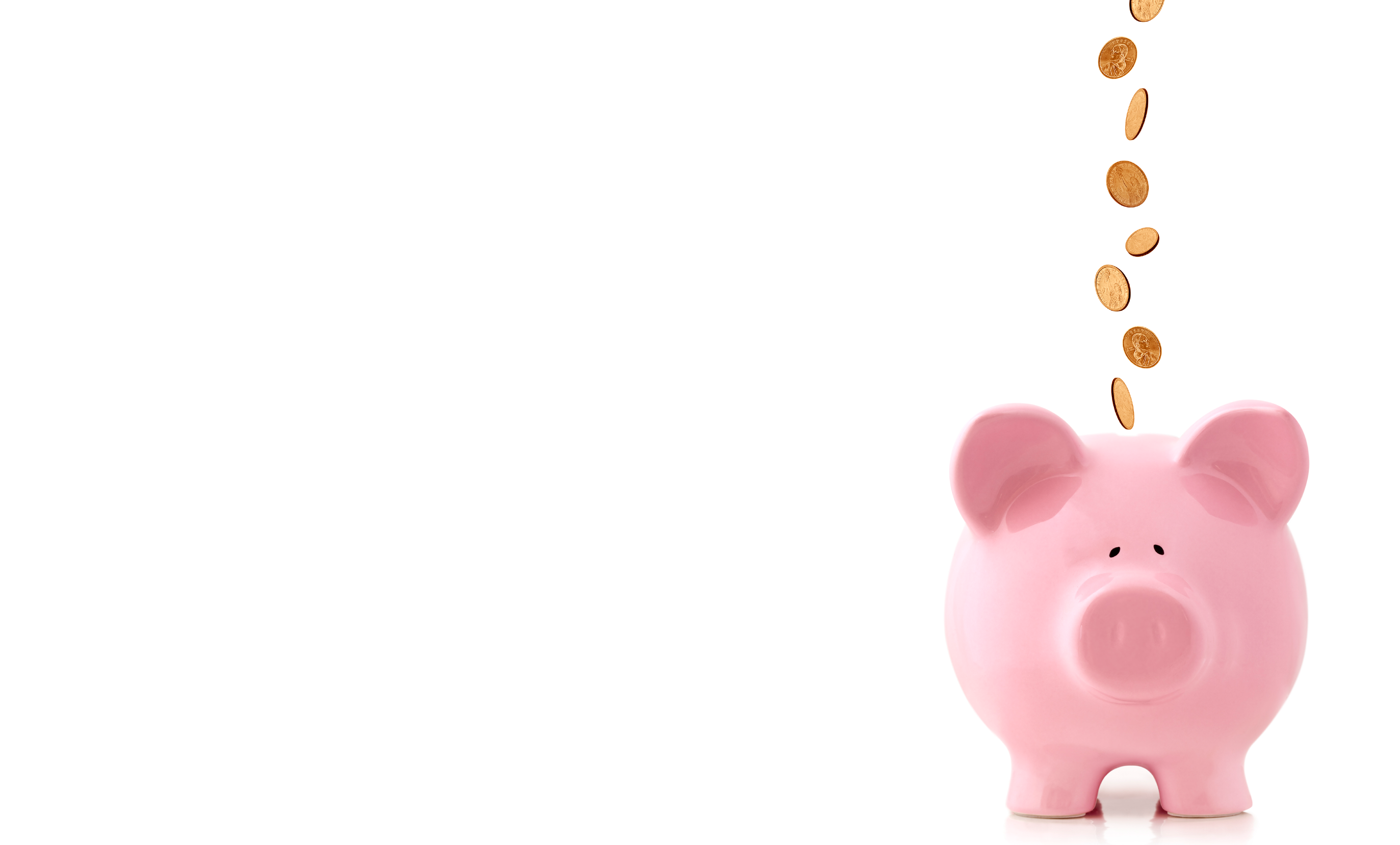 A pink piggy bank and cascading pennies