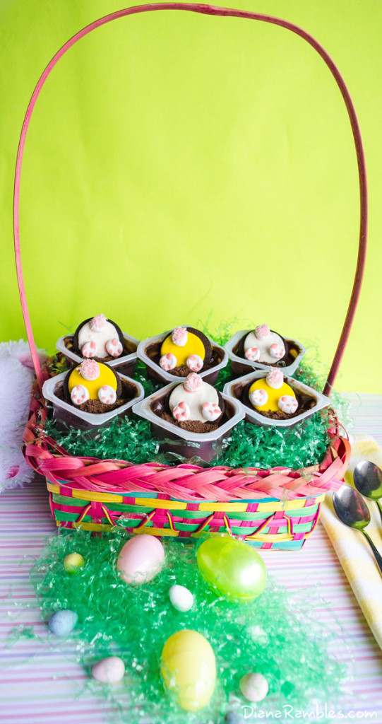 An Easter basket containing several bunny butt pudding cups 