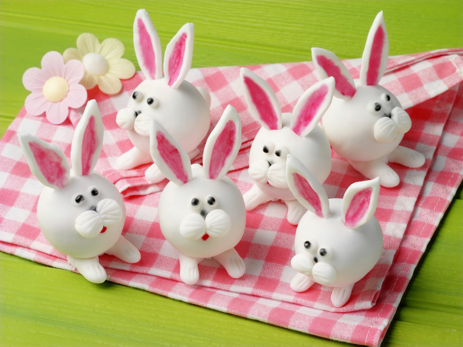 Bunny truffles on a pink checkered cloth. 