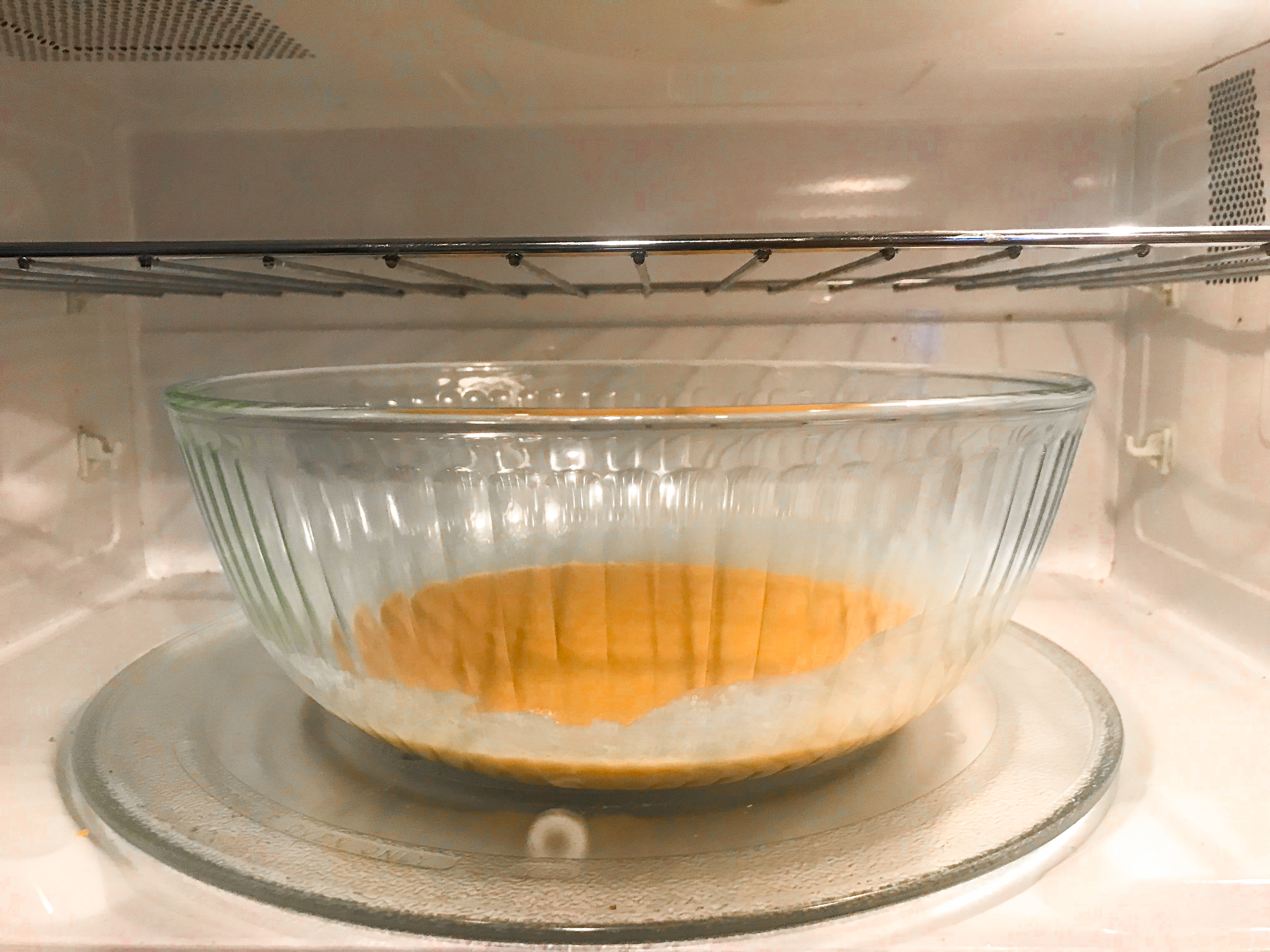 Sugar and cream mixture in a microwave. 