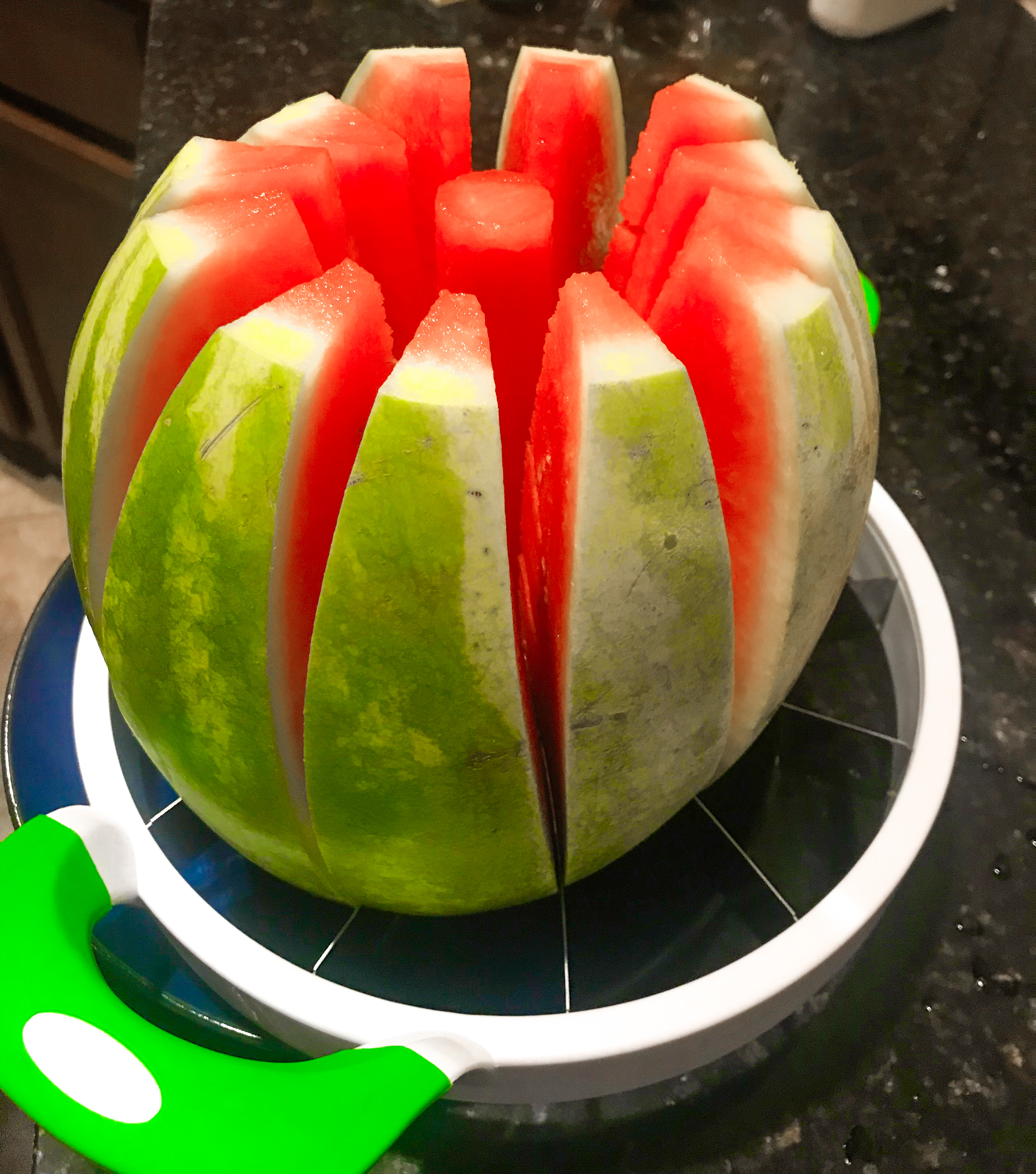 A watermelon sliced with a watermelon slicer. 